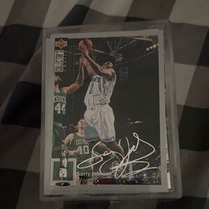 Larry Johnson Basketball sighned Trading Card And Extra cards plus the case.